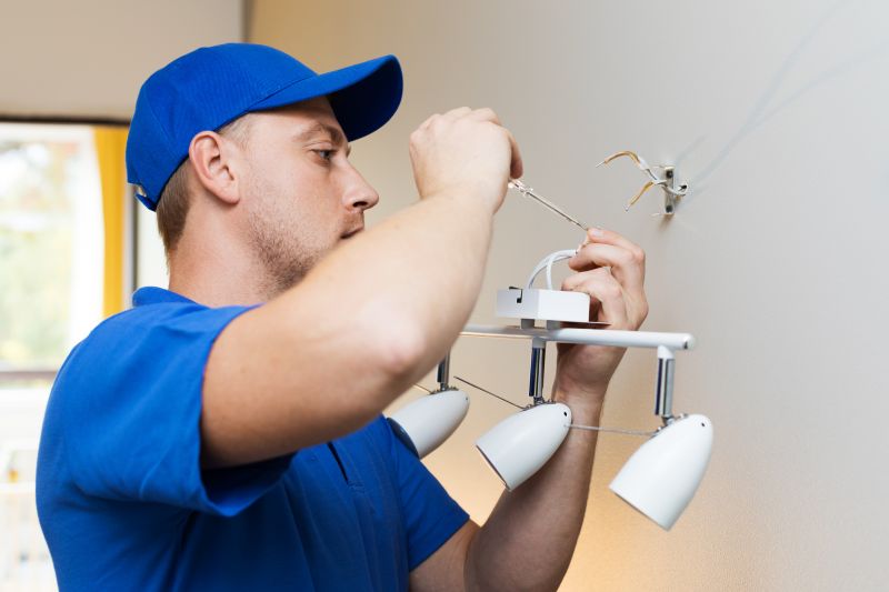Handyman Installing Light Fixture